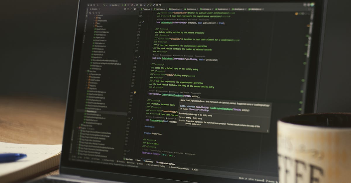 Developer working at a computer with multiple monitors showing code and analytics