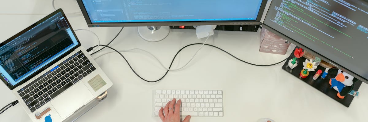 Fintech professional reviewing competitive market data on laptop