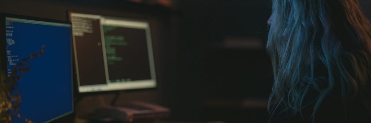 SaaS team analyzing competitor data with multiple analysis tools on a large monitor