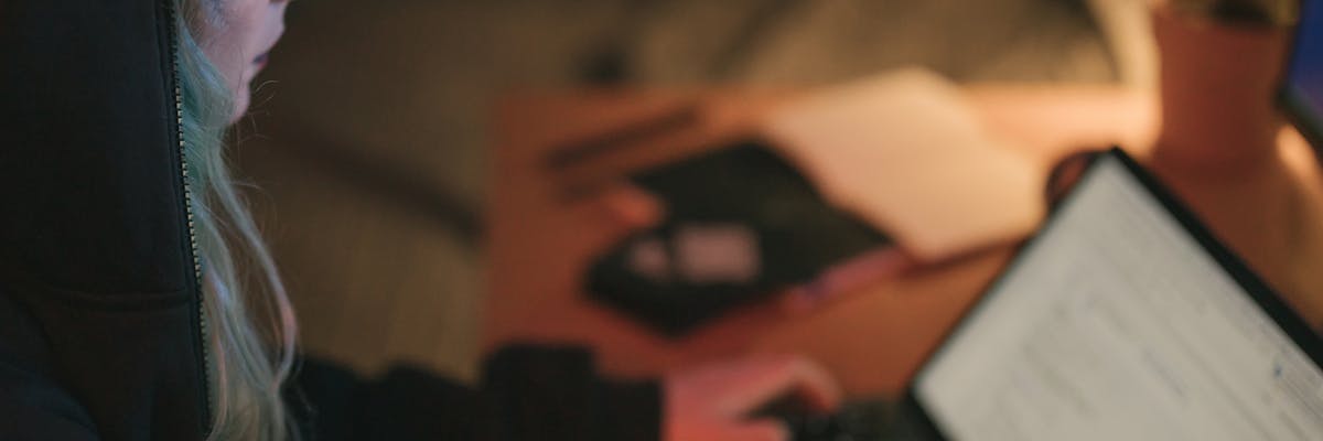 Founder using free competitive intelligence tools on a laptop in a home office