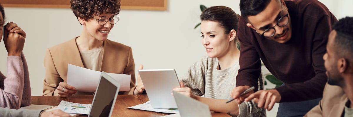 Startup founder writing a sales strategy document with their team