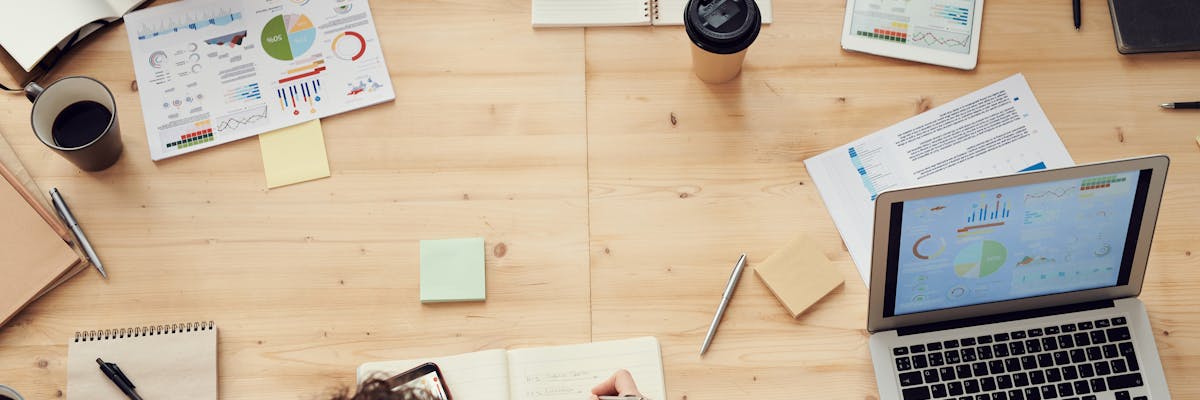 Frustrated sales rep looking at outdated competitive documents on a desk
